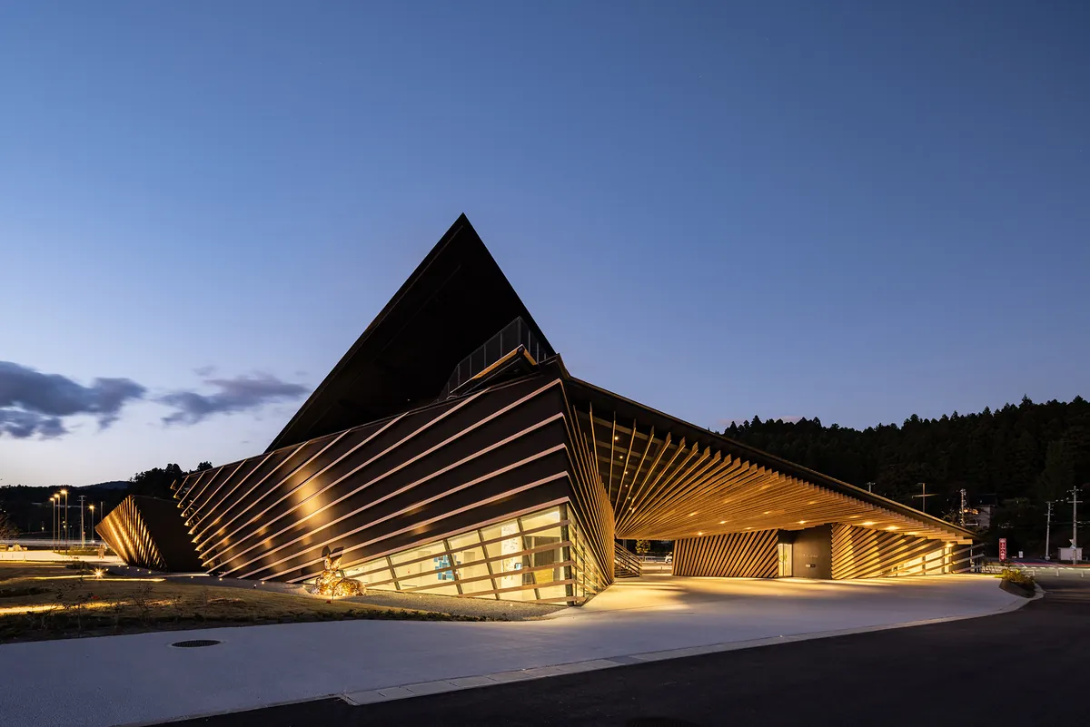 Locally-sourced Minamisanriku cedar adorns the exterior of this L-shaped building designed to resemble a ship