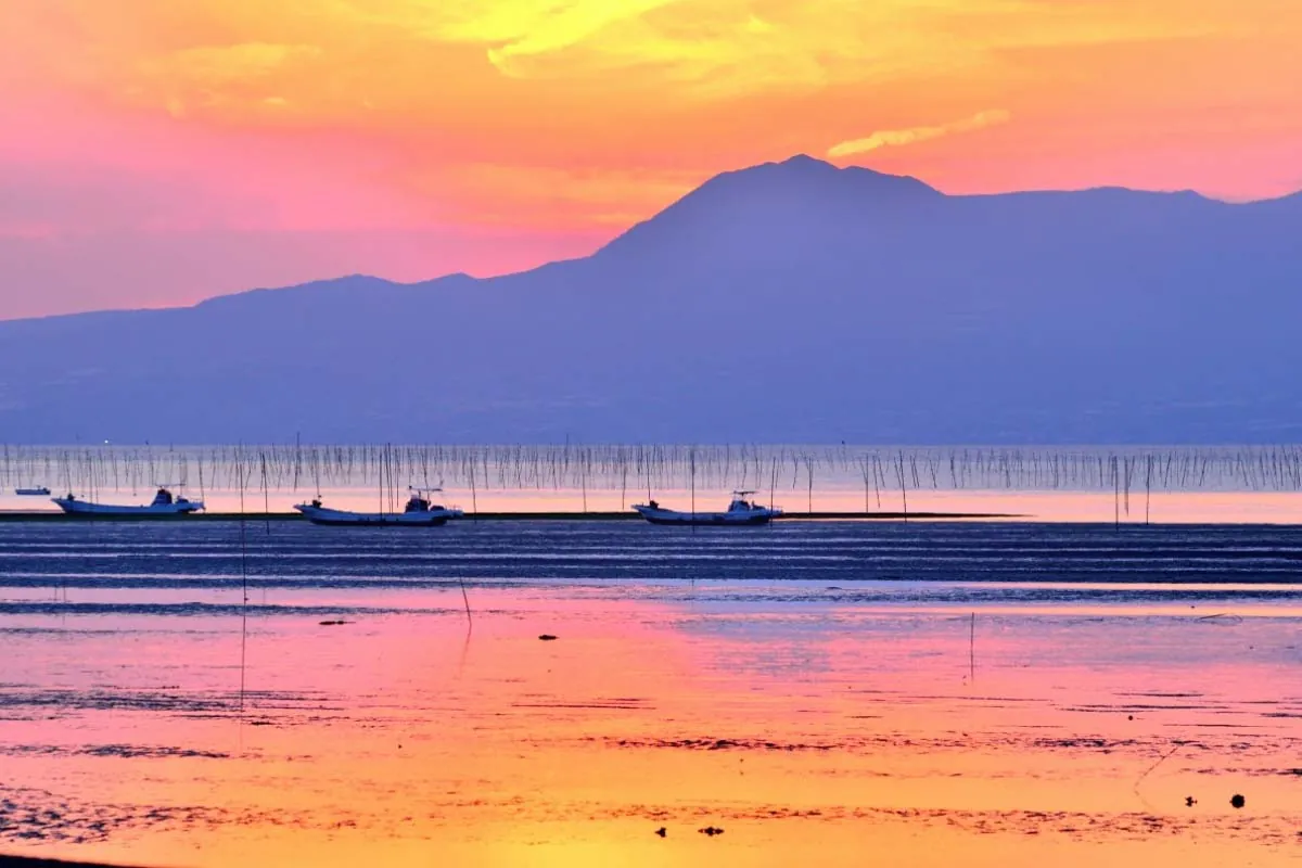 Okoshiki Beach at low tide reveals intricate sand patterns created by the Ariake Sea's dramatic tidal range