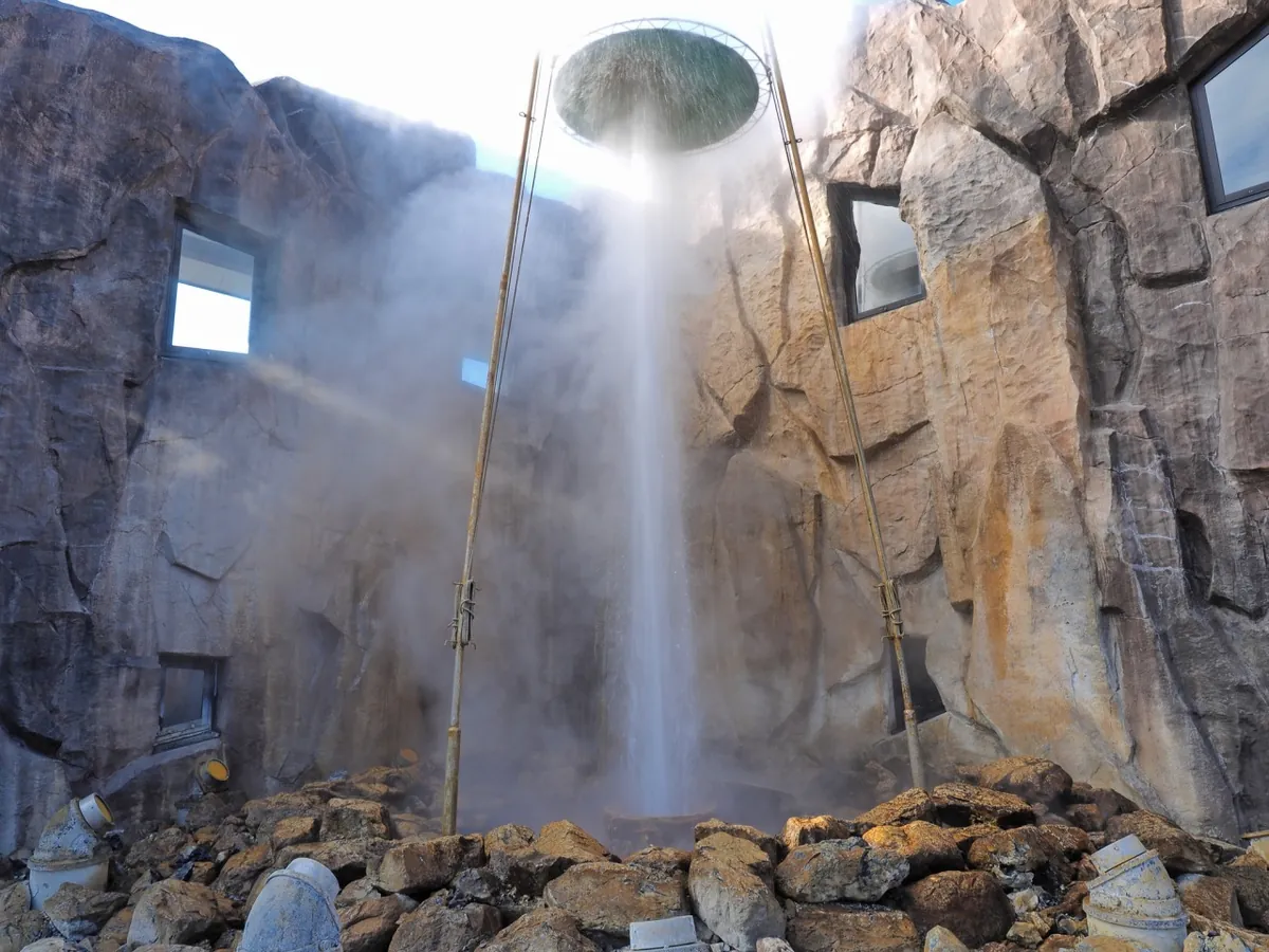 Visitors soak their feet in the geothermal footbath while watching the clockwork eruptions