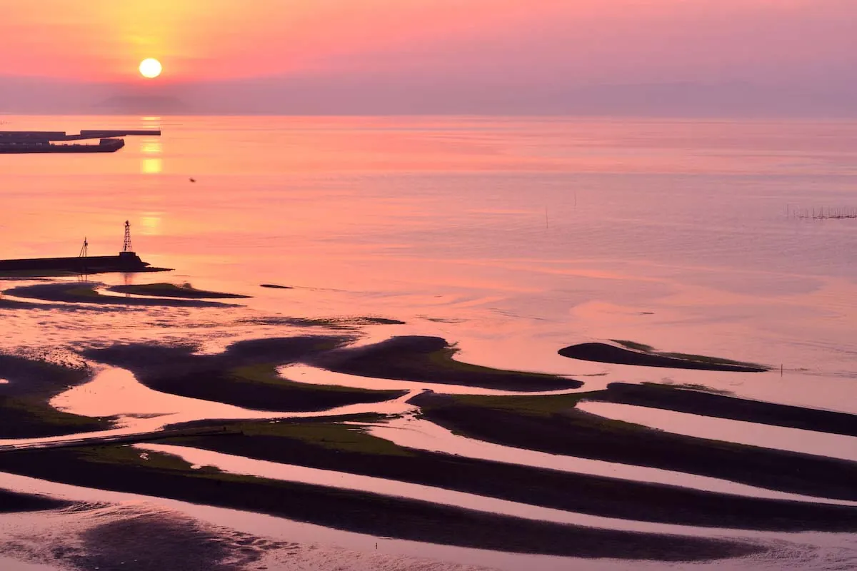 When low tide coincides with sunset the wet sand turns deep orange reflecting the sky like a mirror
